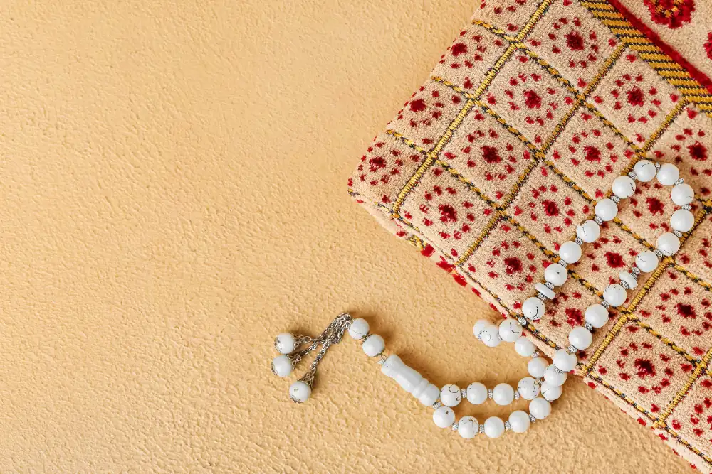 A prayer mat with tasbih beads