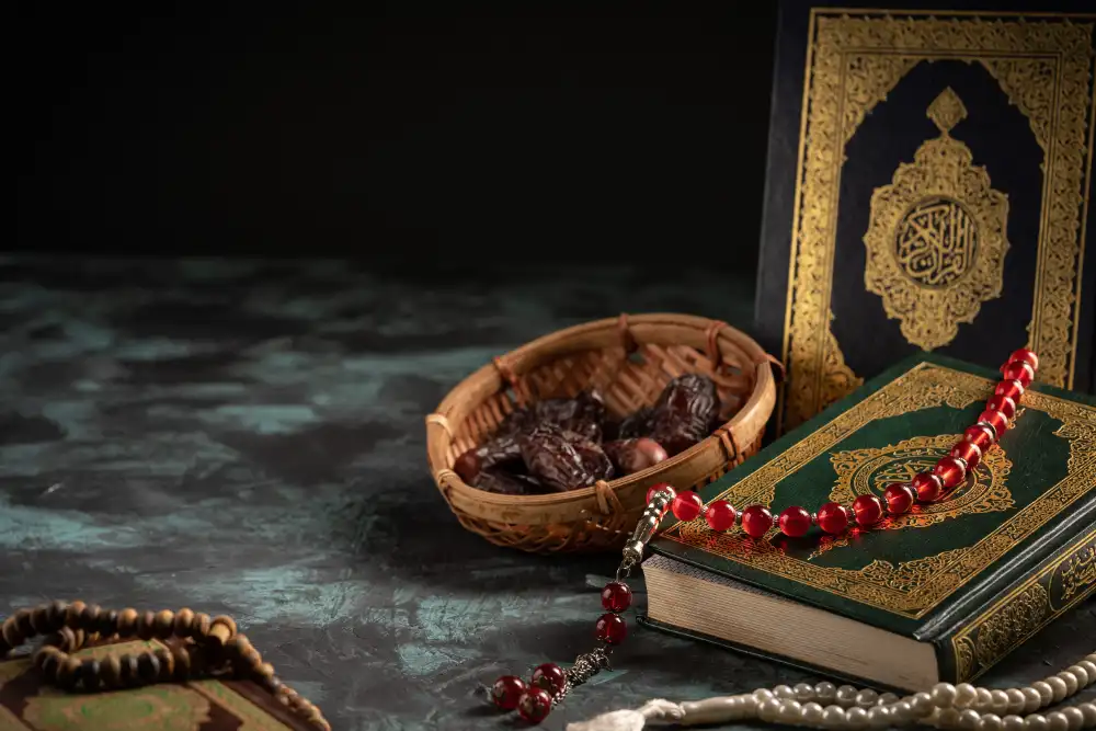 A copy of the Qur'an with prayer beads and dates
